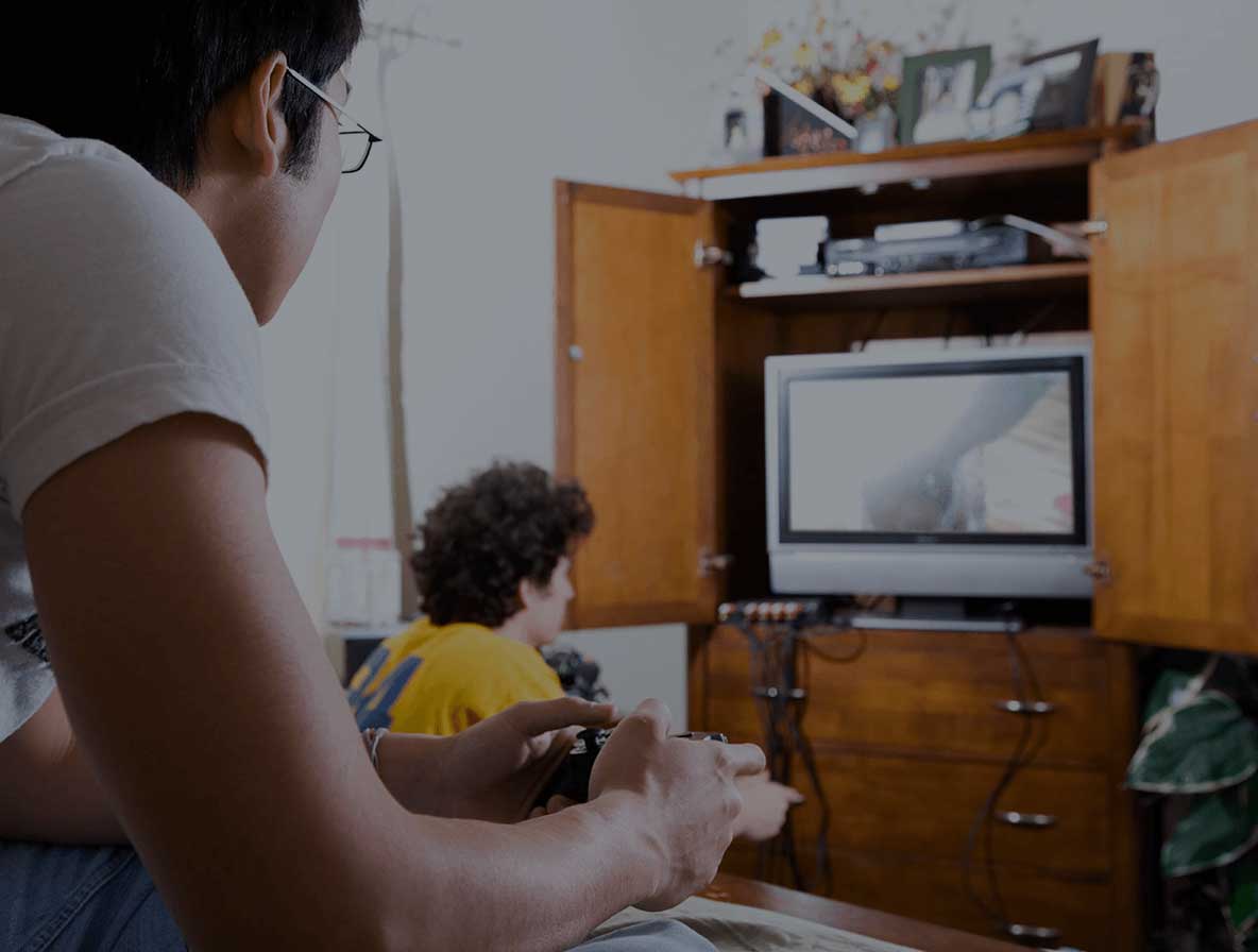 two male kids playing video games