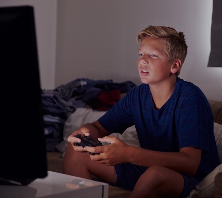 teen playing video game