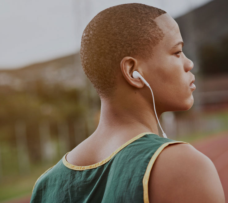 teen runner with headphones